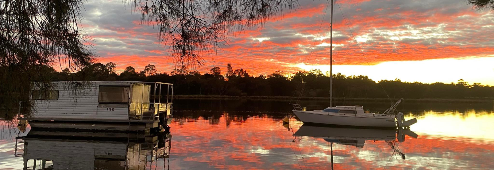 A bright orange sky during sunrise from the front of Sup Tonic HQ, on the banks of the Swan River in Maylands